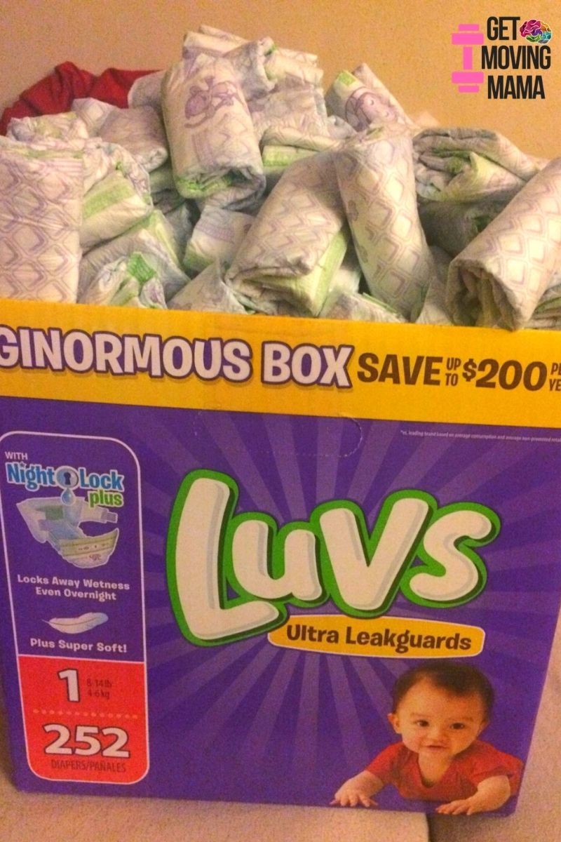 A picture of a box of diapers rolled up to make a diaper cake for a baby shower.