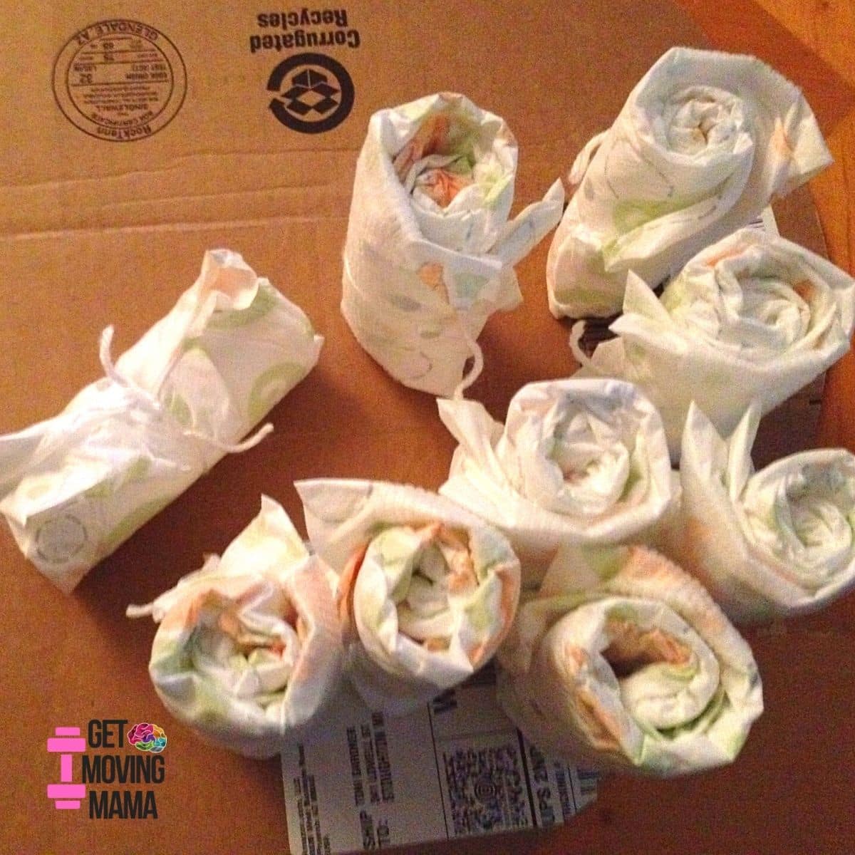 A picture of diapers rolled for diaper cake.