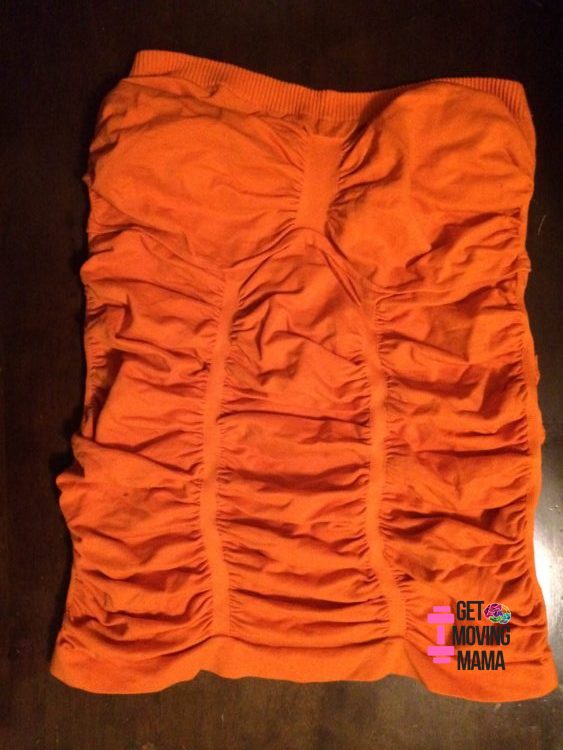 A picture of an orange strapless tank top to make a diy hands-free pumping bra for breastfeeding.