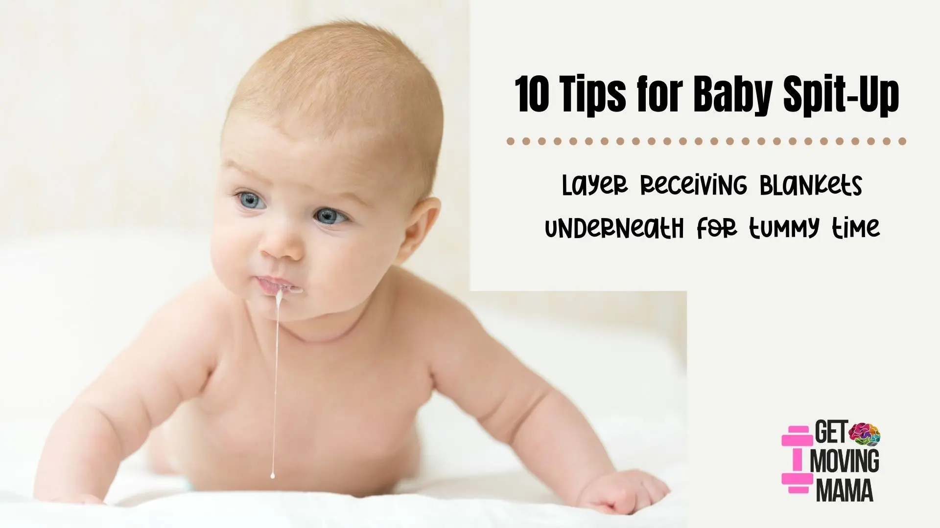 A baby that has spit up playing on a receiving blanket underneath for tummy time.