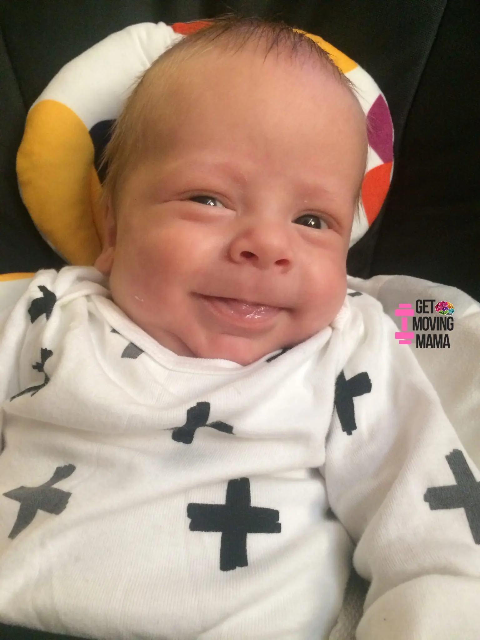 A picture of a baby boy sitting in a Mamaroo.